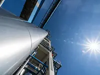Looking up the A-ConApex reactor with sky and sun visible