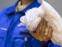 Dissolving pulp fibers in a person's hand